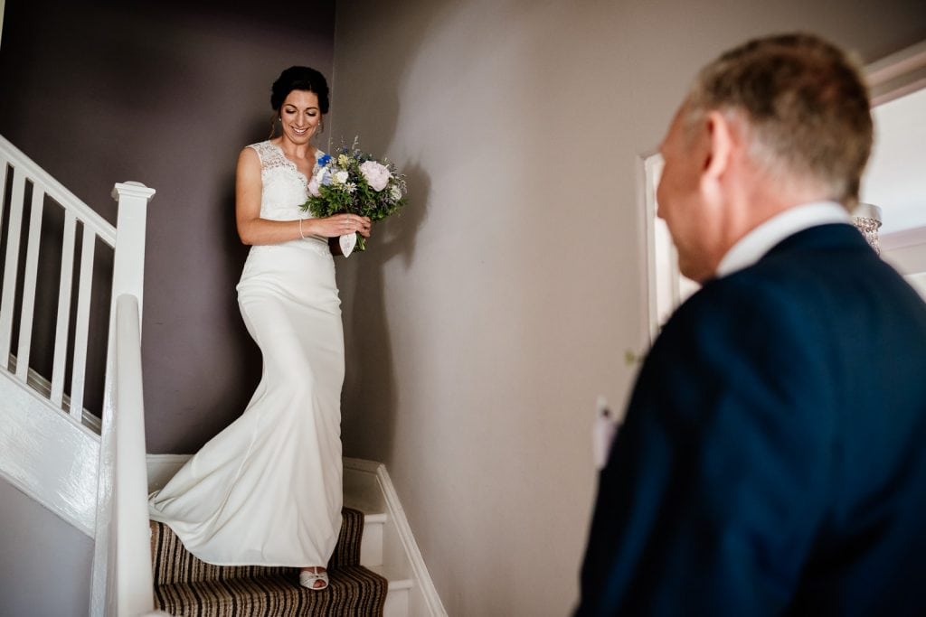 Bride descends the staircase in The Manor House at THe Green